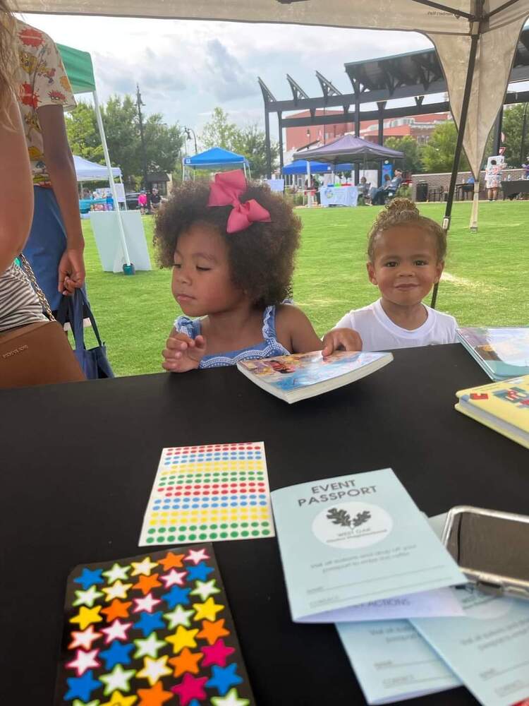 Children receiving their event passport 