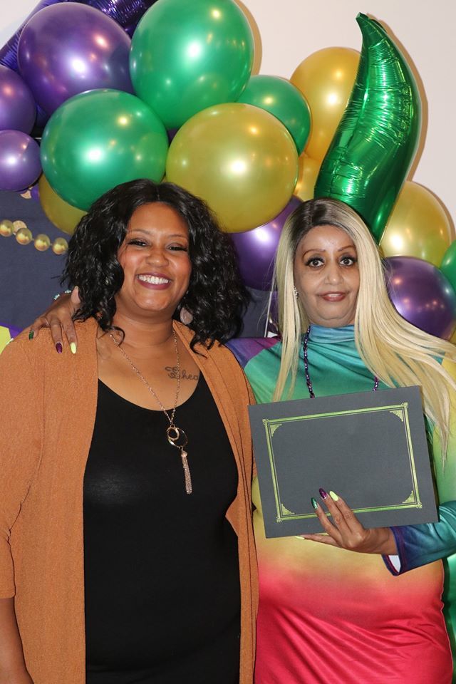 residents with earned certificates at banquet